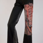 Black striped trousers with prints and appliqués