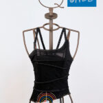 Asymmetric black stretch top with print