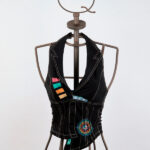 Black sleeveless jacket with print