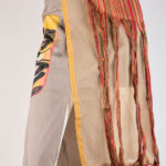 Gonna midi asimmetrica con applicazioni e stampa