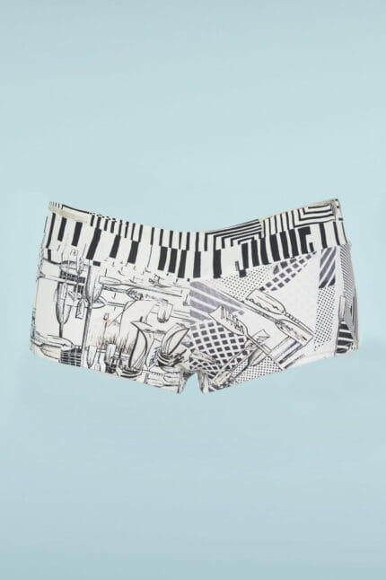 Bermuda shorts swimsuits with black and white graphic print, featuring patterns inspired by musical notes and abstract designs, on a light blue background. Ideal for summer activities and water sports.