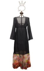 Black long dress with puff sleeves and colorful skirt, displayed on a mannequin. Perfect for summer occasions and elegant evenings.